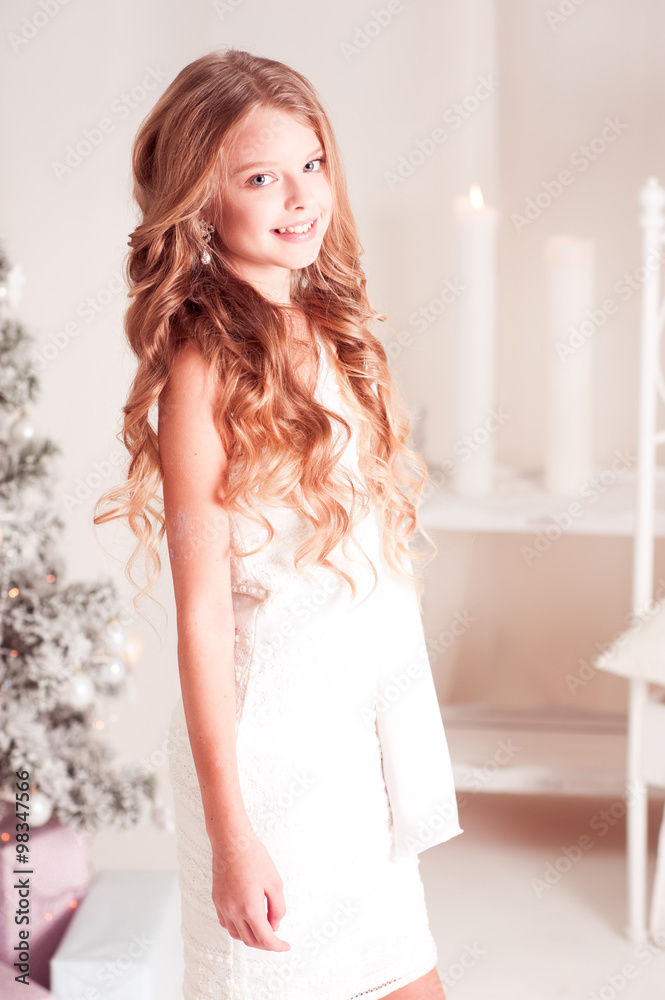 Cheerful teen girl 14-15 year old wearing white dress in room. Looking at  camera. Teenagerhood. Stock Photo | Adobe Stock