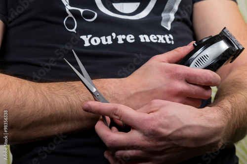 Hair Stylist Holding In Hand Scissors And Hairdresser Equipment