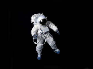 astronaut floating against a black background.