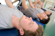 © auremar - Men exercising, holding knee to chest