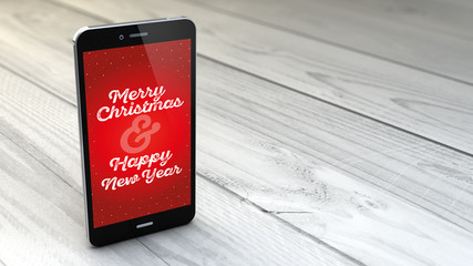 Wall Mural - smartphone with christmas greeting over white wooden background