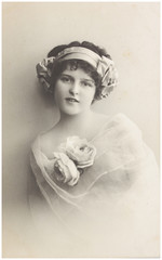 old photo portrait of young woman with flowers