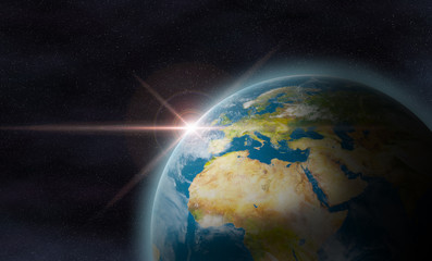 planet earth with sunrise in space