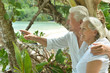 © aletia2011 - elderly couple rest at tropical resort