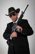 © pepscostudio - Old gangster portrait with machine gun