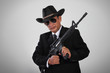 © pepscostudio - Old mafia and his assault weapon