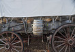 Side view of pioneer wagon with water barrel and canvas top