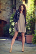 © ZoomTeam - Fashionably dressed woman on the streets of a small Italian town