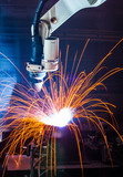 Fototapeta Tęcza - Robot welding movement Industrial automotive part in factory