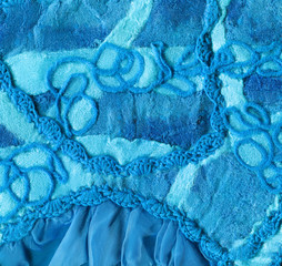 Wall Mural - Turquoise fabric with knitted lace and chiffon frill. The fabric is made from wool for felting