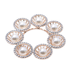 Wall Mural - gold brooch with pearls isolated on white