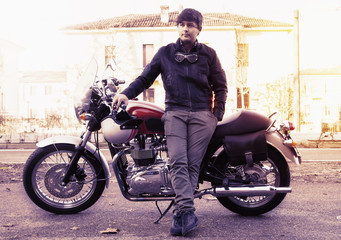 young biker relaxing leaning your motorcycle