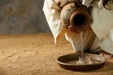 Fototapeta Sport - Jesus pouring water from a jar