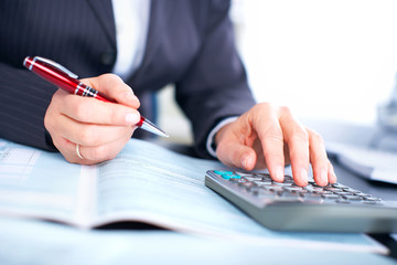 Aufkleber - Hands of accountant business woman with calculator.