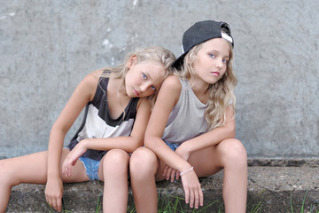 Wall Mural - portrait of two girls of girlfriends on a summer nature