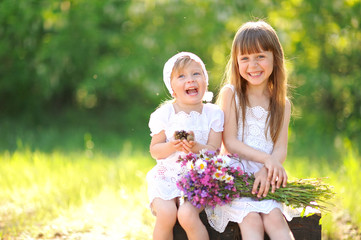 portrait of two girls of girlfriends on a summer nature