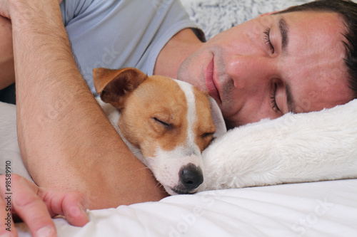 Foto-Tischdecke - Sleeping dog and owner. Man and dog sleeping together (von dream@do)