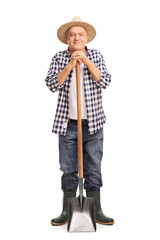 Sticker - Mature agricultural worker posing with a shovel