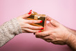 © bluebeat76 - Hands giving and receiving a present