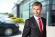 © fotofabrika - Young Businessman looking over his shoulder