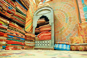 Cupboard of traditional Indian souvenir shop, full of silk shawls and scarves