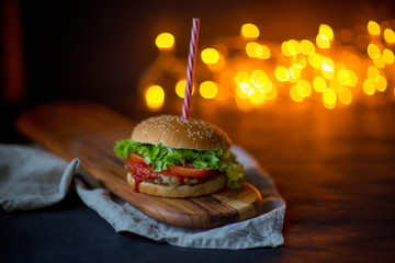 Home made hamburger, Christmas concept, bokeh, dark photo, selective focus