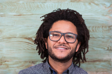 Wall Mural - Studio portrait of cool black young man with black glasses, stri