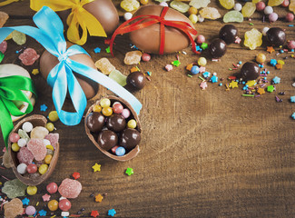 chocolate candy eggs biscuits candies on a wooden table