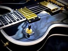 Fashion Electric Les Paul Guitar On Genuine Leather Close-up 