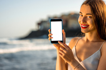 Woman showing phone with white screen