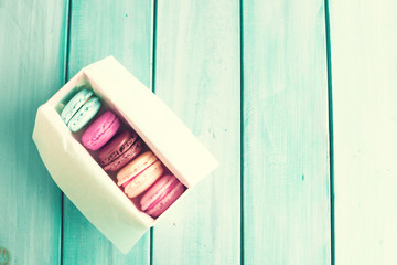 Wall Mural - Box of macaroons over turquoise wood