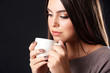 © Africa Studio - Portrait of pretty woman with cup of coffee