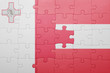 © luzitanija - puzzle with the national flag of malta and austria