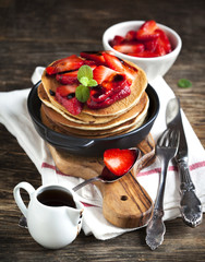 Wall Mural - Stack of pancakes with fresh strawberry and balsamic glase in fr