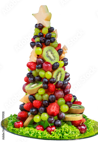 Stampe christmas tree made from fruit Berry on white back ground