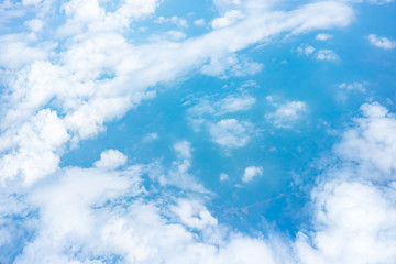 Wall Mural - aerial view of blue sky and cloud top view from airplane window,