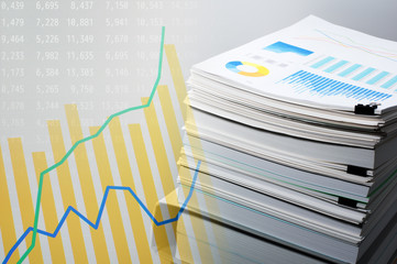 Poster - Documentation and data analysis. Business concept.Pile of documents on gray background. Graph and data on monitor display.
