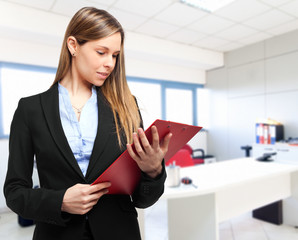 Poster - Smiling beautiful businesswoman portrait in her office