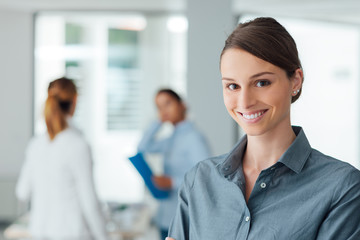 Smiling female office worker portrait