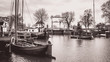 The old museum harbor of Gouda in the Netherlands in black and white
