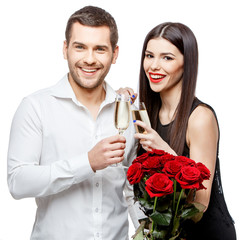 Young beautiful couple with flowers isolated on white