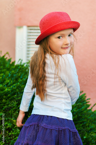 Outdoor portrait of a cute little girl of 5-6 years old  