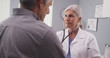 © Mark Adams - Doctor listening to patient's heart rate with stethoscope