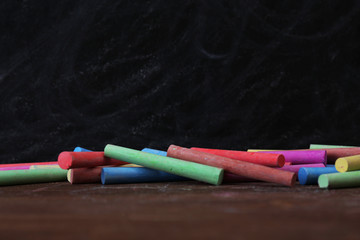 Wall Mural - Many chalks on desk background