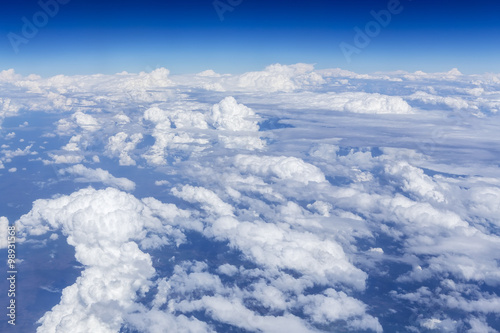 Fototapeta na wymiar Sky and cloud as seen through window of an aircraft