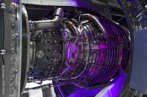 Fotografie, Obraz Jet engine, internal structure with hydraulic, fuel pipes and other hardware and