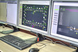© phadventure - Computers and monitors with schematic diagram for supervisory, control and data acquisition in modern electrical control room
