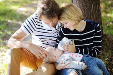 Happy parenthood,  focus on baby face