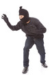 © japhoto - Burglar wearing mask on over white background