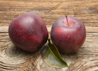 Stark apples on wooden background